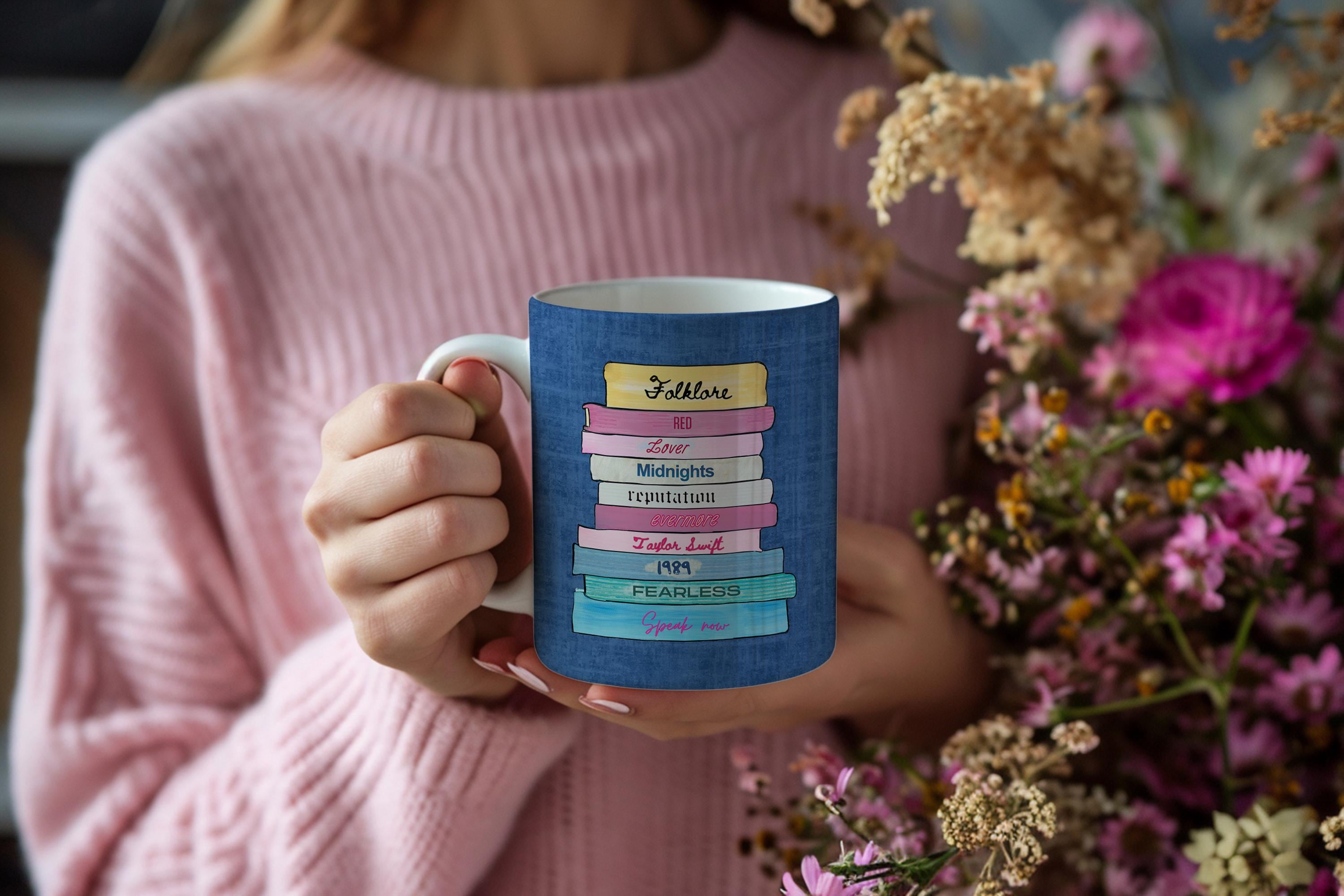 White ceramic mug with Taylor Swift albums as classic books design