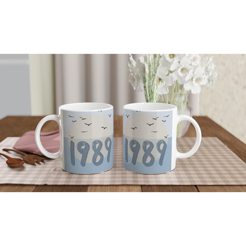 Ceramic coffee mug with blue bird design inspired by Taylor Swift