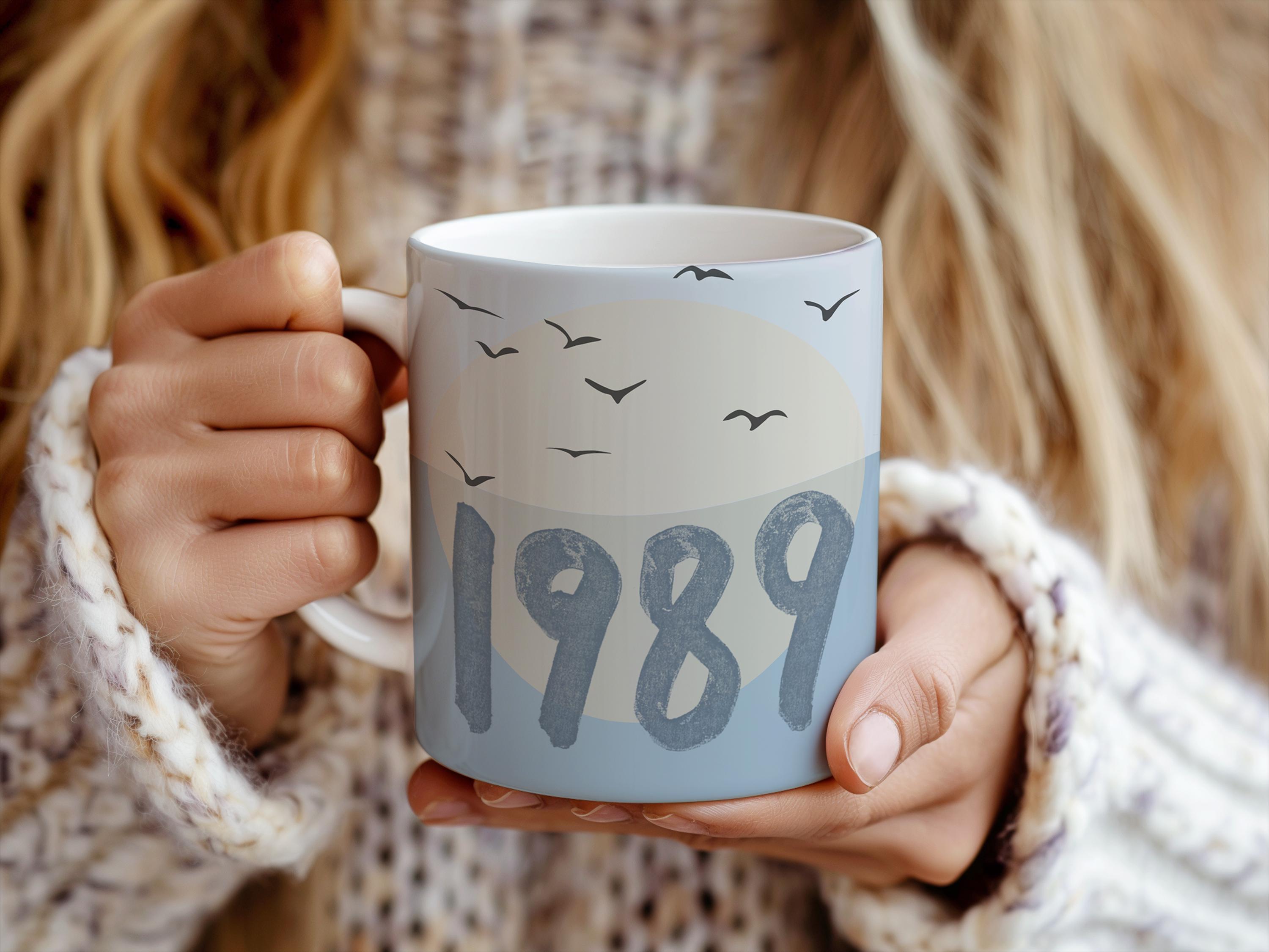 Ceramic coffee mug with blue bird design inspired by Taylor Swift