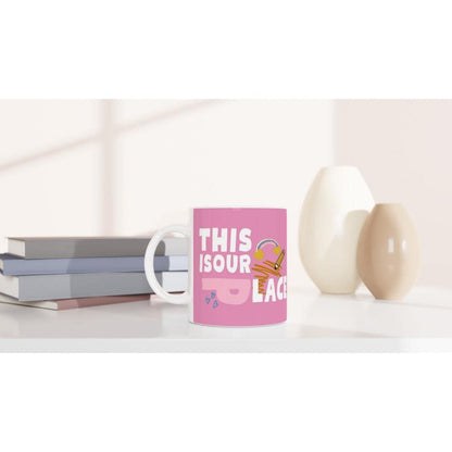 Pink ceramic coffee mug with Fearless and Speak Now Taylor Swift designs