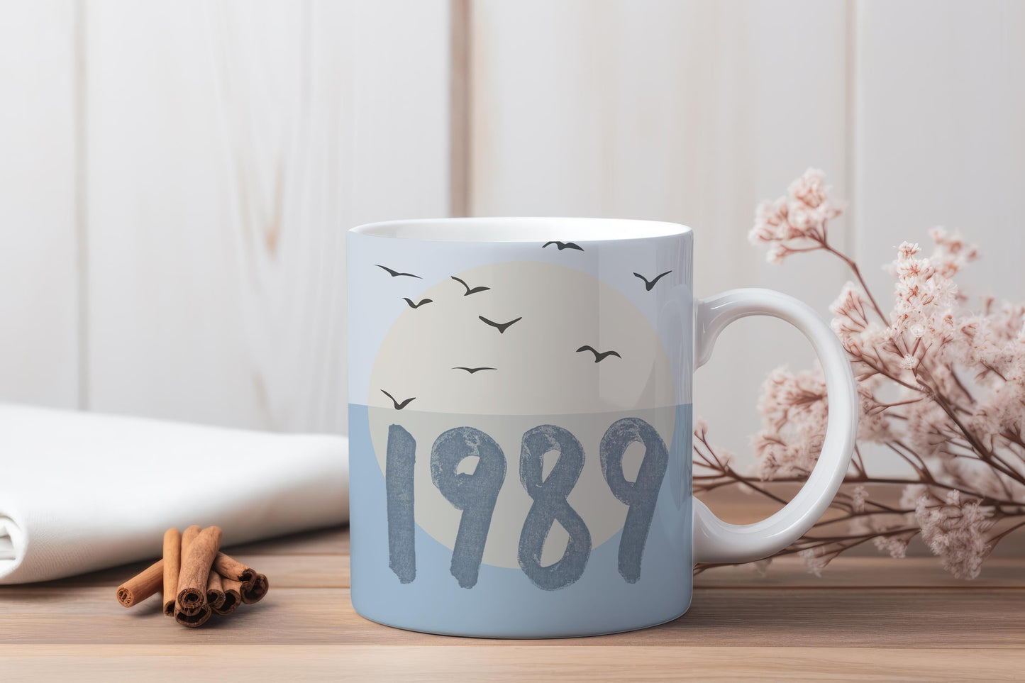 Ceramic coffee mug with blue bird design inspired by Taylor Swift