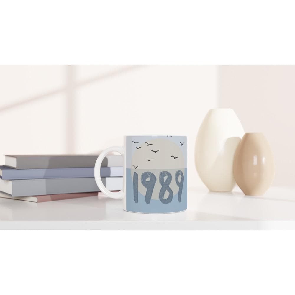 Ceramic coffee mug with blue bird design inspired by Taylor Swift