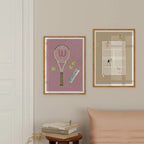 Pink tennis racket print paired with a beige tennis court print above a pink sofa.