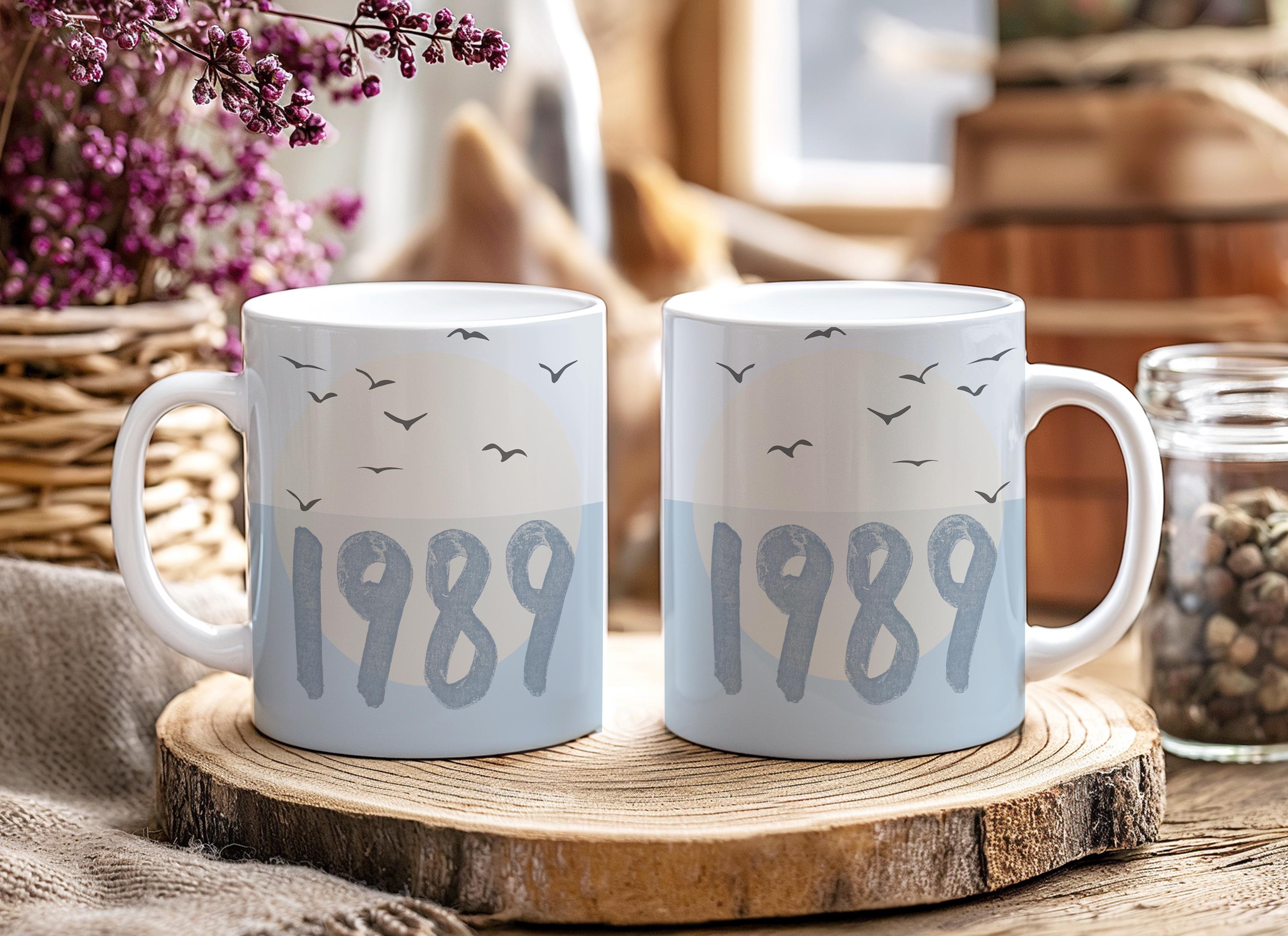 Ceramic coffee mug with blue bird design inspired by Taylor Swift