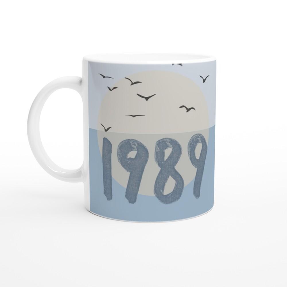 Ceramic coffee mug with blue bird design inspired by Taylor Swift