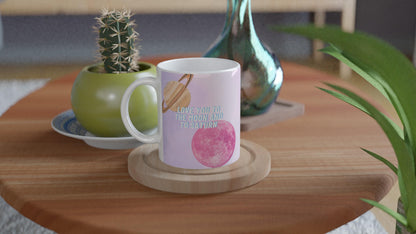 White ceramic mug with Moon and Saturn Taylor Swift lyrics design