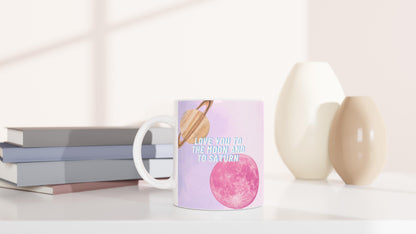 White ceramic mug with Moon and Saturn Taylor Swift lyrics design