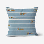Front view of the blue Beach Day Pillow with swimmers in white pool lanes.