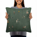 Front view of a person holding the dark green Tiny Golfers pillow.