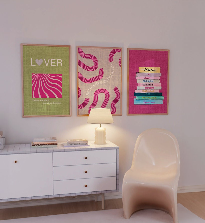 a white chair sitting next to a white dresser