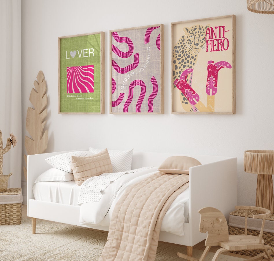 a bedroom with a white bed and two paintings on the wall