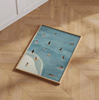 Golden Days framed beach illustration resting on a parquet floor.
