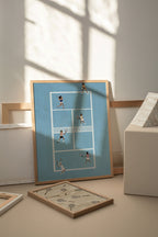 Blue Doubles Delight II framed tennis print in a sunlit room with a smaller beige print.