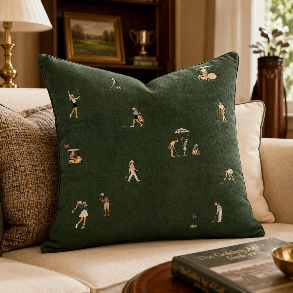 Dark green golf pillow with illustrated women golfers