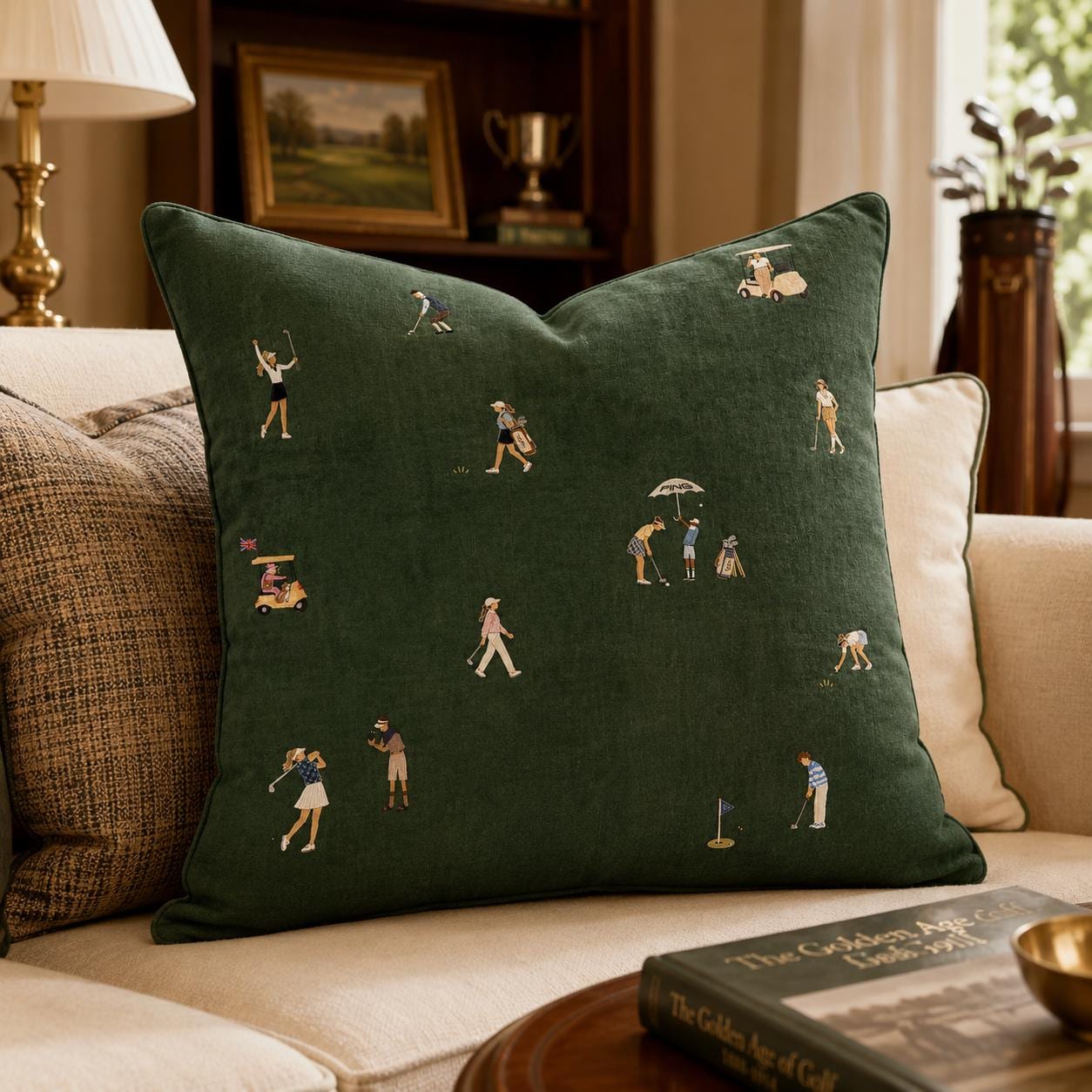 Dark green golf pillow with illustrated women golfers